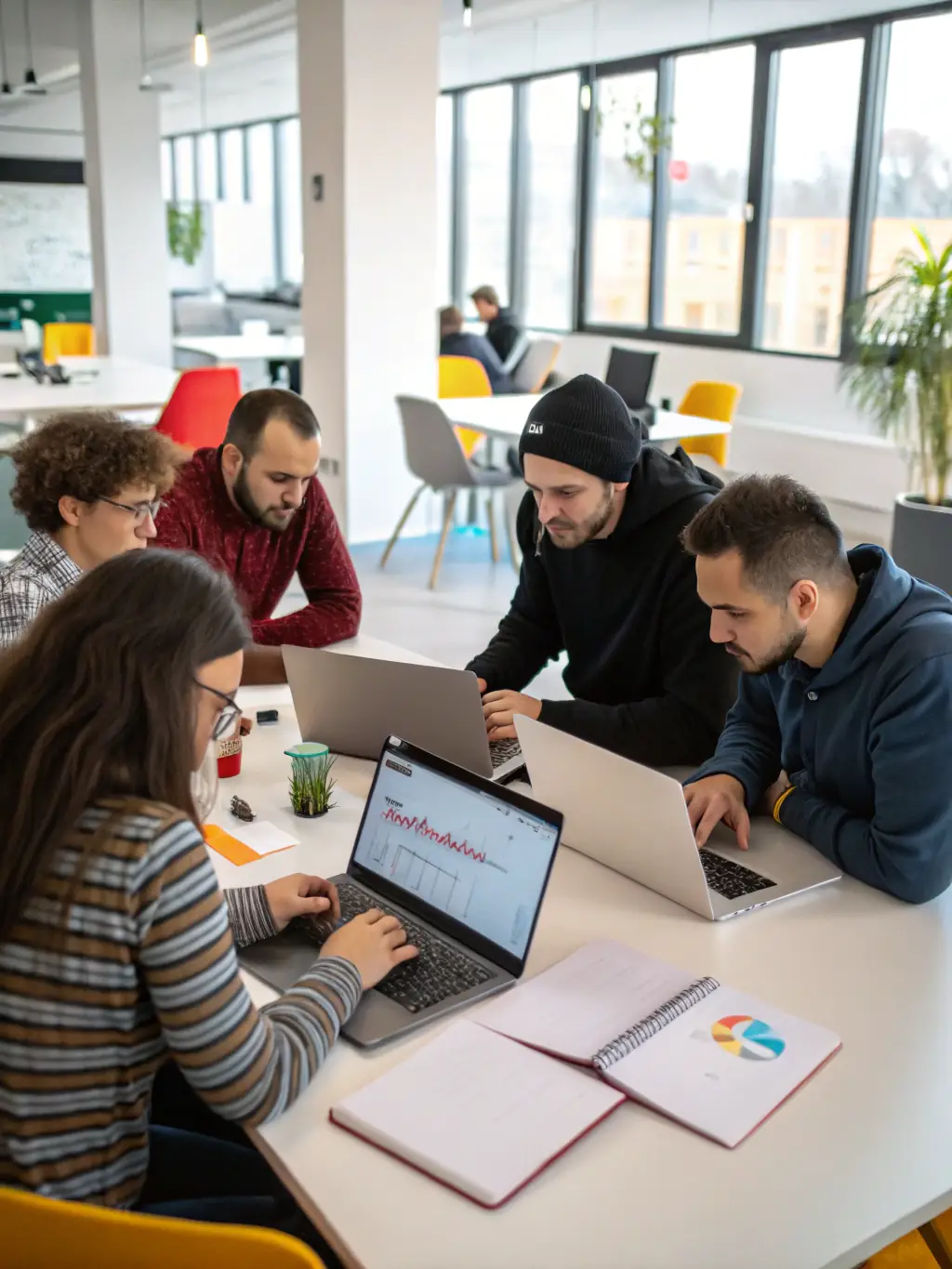 A web development team coding a responsive website design, highlighting their proficiency in PHP, Java, and other web technologies for Omegacube clients.